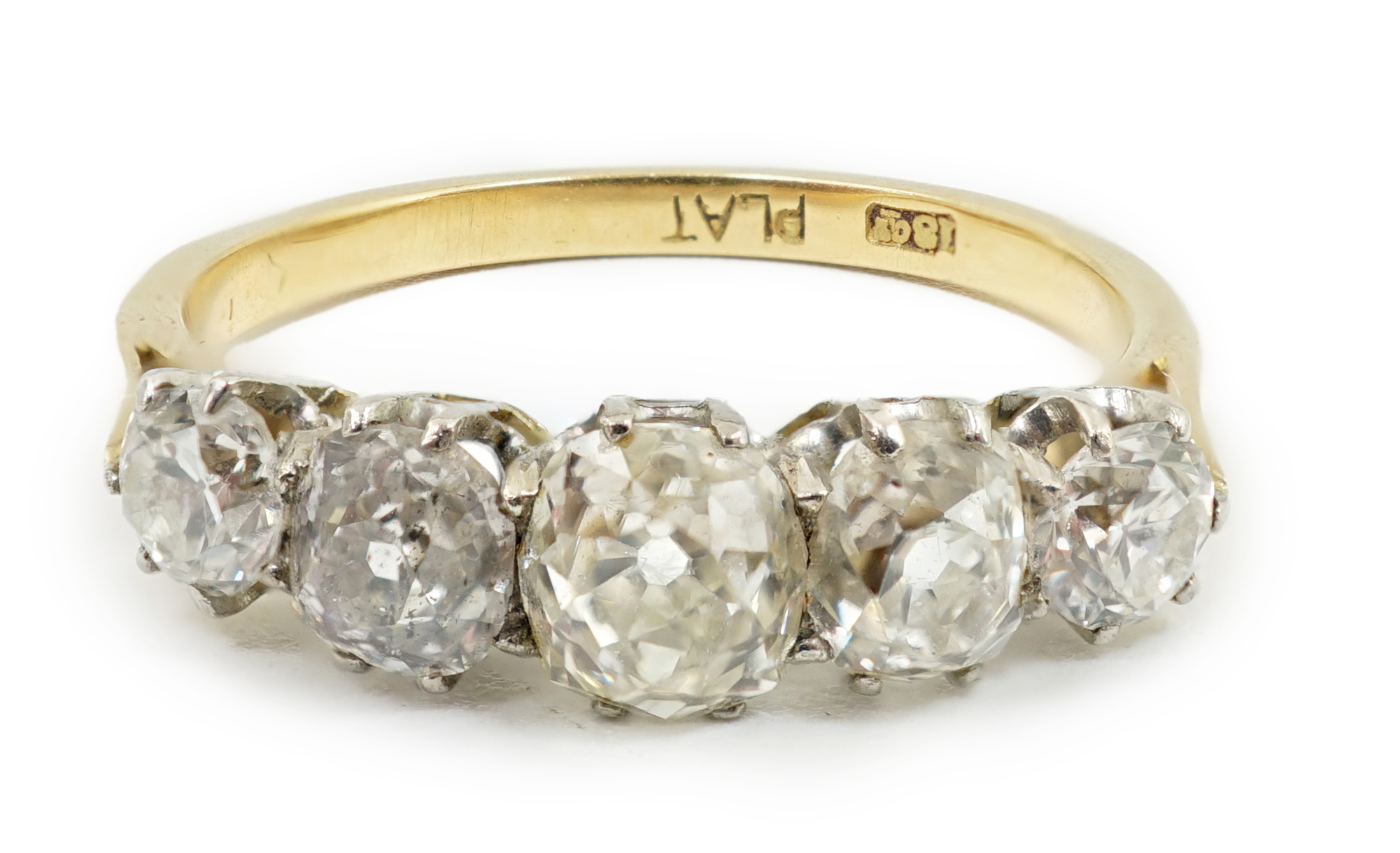 An early to mid 20th century 18ct gold, platinum and graduated five diamond set half hoop ring